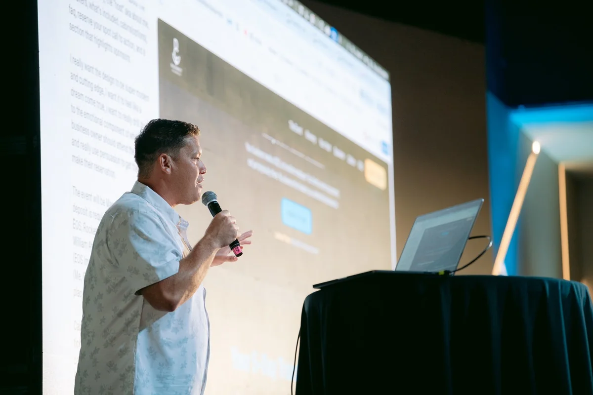 adrew speaking on stage